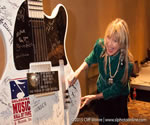 Becky adds her name to the Oklahoma Music Hall of Fame guitar.